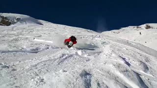 Guy red snow jacket skiing back flip fail