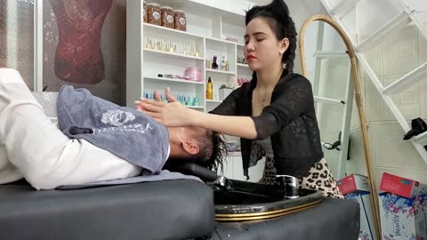 Beautiful girl, relaxing with Anh Thu at a Vietnamese barber shop