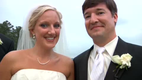 Wedding videographer falls down hill, still gets the shot!
