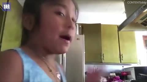 Little girl lifts up her baby sister by the head. It's so HILARIOUS!