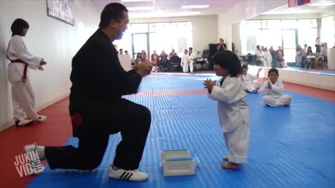 Funny Little boy trying to break board in Teakwando