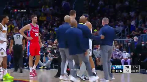 Nikola Jokic steps between his coach and the ref 😮