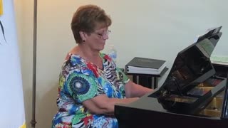 Claudia Vining plays piano at Royal Palm Presbyterian Church