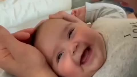 Baby gets lots of kisses from his daddy for her cuteness