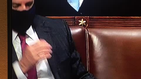 Democrat removes mask to sneeze in his hand