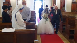 The bride is handed over to the groom.