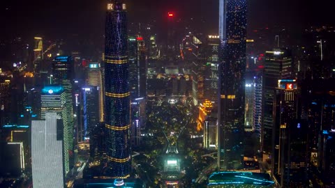 Futuristic buildings flashing in the night