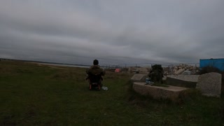 Chilling by lighthouse overlooking the sea. Timelapse