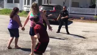Kids Enjoy Water Balloon Battle With Police Officer