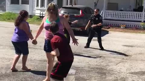 Kids Enjoy Water Balloon Battle With Police Officer