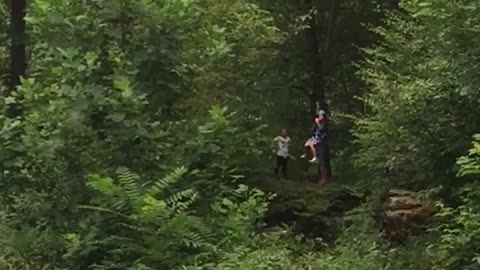 Zip Lining Boy Nearly Knocks Mom's Head Off After Insane Mid Air Collision