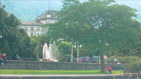 stresa italy building and park with fountain people outdoor summer