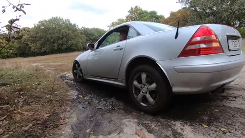 Blonde gets stuck in a Mercedes and calls for help