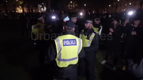 U.K Policewoman getting hit in the head by a plastic bottle