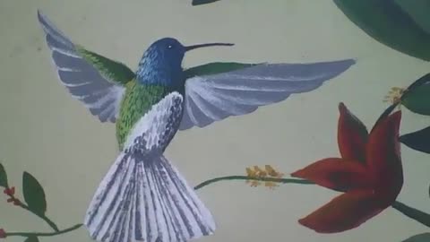 Hummingbird green, white and blue, next to a red flower, drawn on the wall [Nature & Animals]