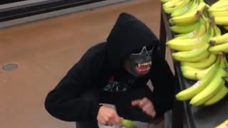 Guy acting like monkey and and slipping on banana