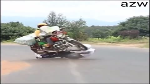 Travelling At High Speed On A Skateboard Downhill On A Busy Road In Kenya