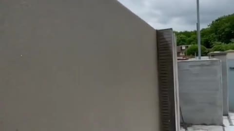workers perfect work on wall cement - tube home