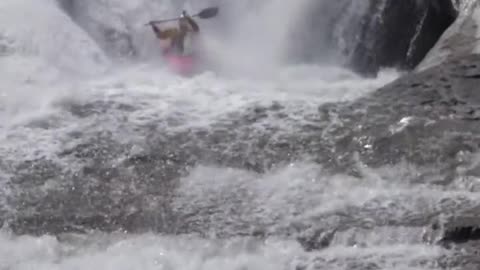 Stunt kayaking down the falls