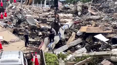 Florida rescue crews tackle collapsed building debris