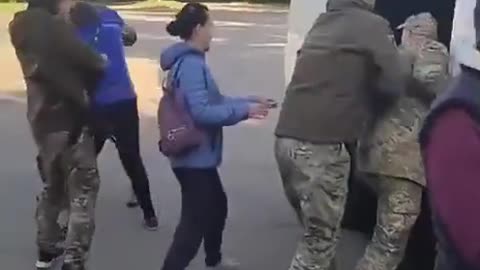 Passing Ukrainians are trying their best to help the mobilization.