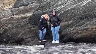 Tides Trap Women on Rock