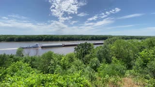A Massive Barge Heading Upstream on the Mississippi