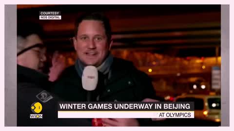 Chinese officials drag away Dutch reporter as Winter Olympics are underway in Beijing