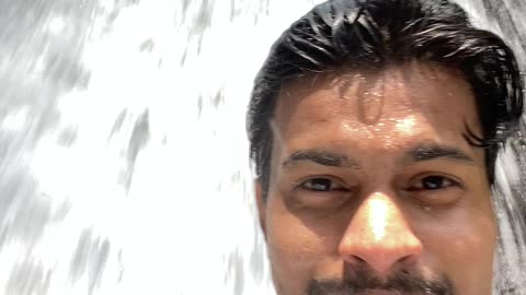 Taking shower from the Waterfall.