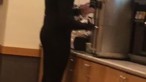 Guy in restaurant with full wetsuit