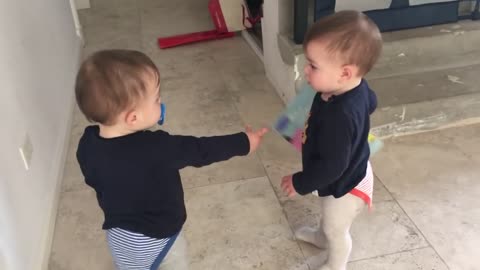 cute twins baby fighting