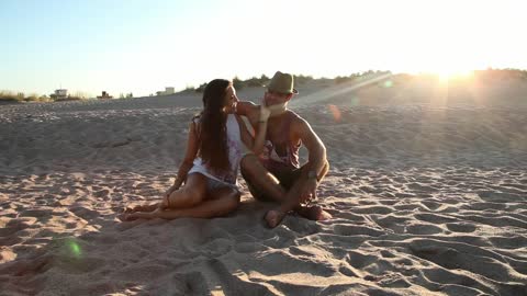 Couple on the beach during sunset