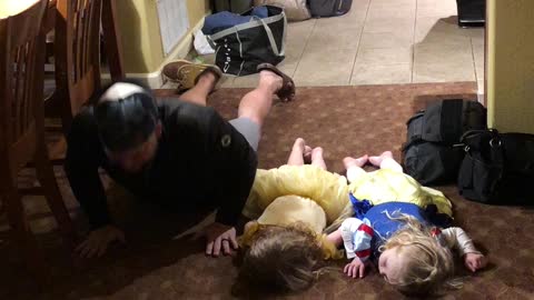 Little girls hilariously attempt to do “the worm” dance move