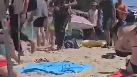 Young male immigrants arrived at the beach in Mallorca, Spain during the day.