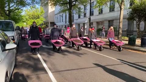 Climate activists are dumping wheelbarrows full of cow poop at the White House on Earth Day