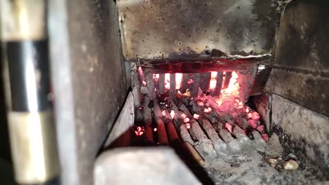 Running a rocket stove with an adjustable pellet basket!