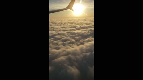 AEROPLANE OUTSIDE VIEW OF CLOUDS AND SO BEAUTIFUL SUNNY