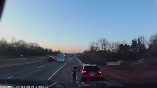 SUV Loses Bumper While Squeezing Between Trucks