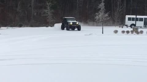 Jeep playing in the snow