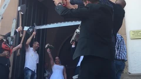 Newlyweds Receive Unique Chainsaw Wedding Send-Off On Their Big Day