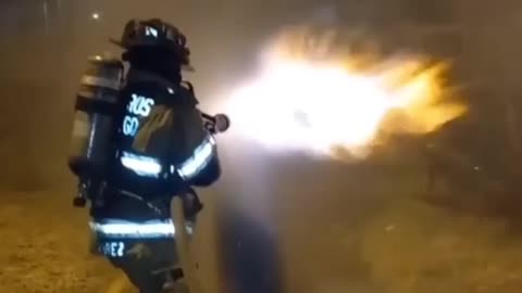 Firefighter Using water as a shield!