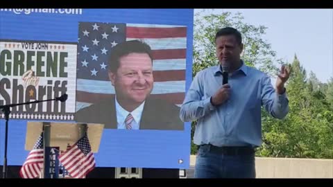 John Greene speaks at the Rally on the River