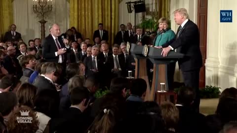 Journalists laugh at Donald Trump after he answers a question