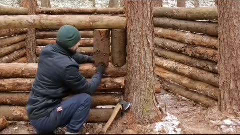 PART 2 Building a warm winter shelter in forest. Follow for more.