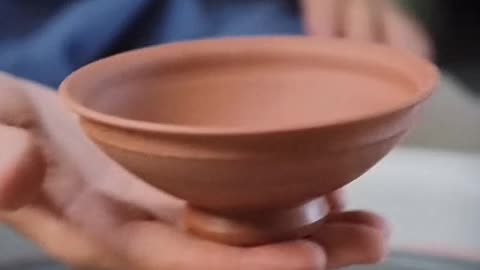 How To Trimming a Small Indented Stoneware Bowl on the Potter's Wheel