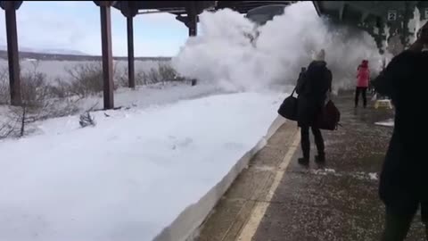 A Snow Blizzzard Buries people on train station 😱