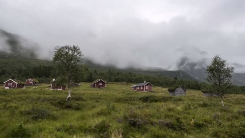 cloudy day with mountains cabins