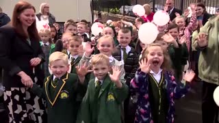 Prince William and his wife Kate sing nursery rhymes during school visit