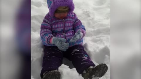 Baby Adorably Fails At Making Snow Angels
