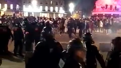 One of macron's minions throws a gas grenade straight off the head of a protester in Paris.